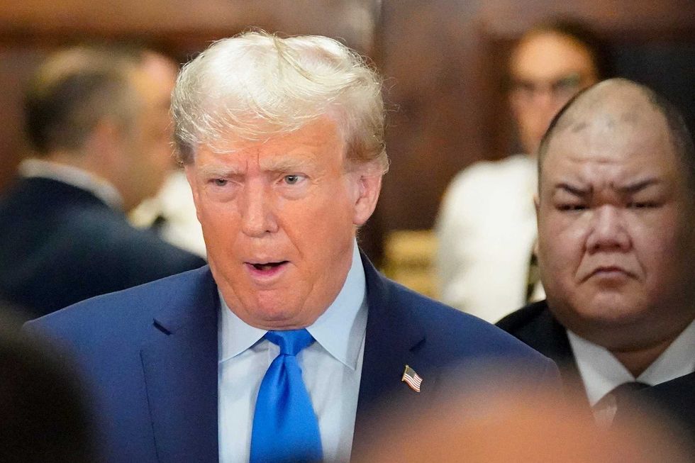 Donald Trump, center, arrives at New York Supreme Court on Oct. 2, 2023
