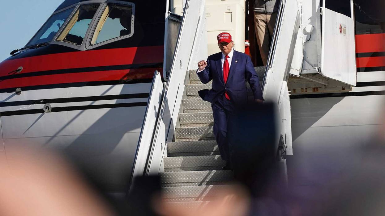 Donald Trump gets off plane in Freeland, Michigan