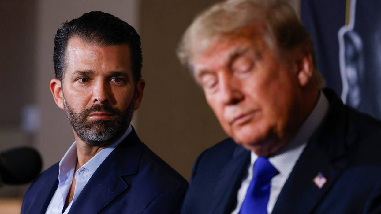 Donald Trump Jr. and former President of the United States Donald Trump look on prior to the fight between Evander Holyfield and Vitor Belfort during Evander Holyfield vs. Vitor Belfort presented by Triller at Seminole Hard Rock Hotel & Casino on September 11, 2021 in Hollywood, Florida