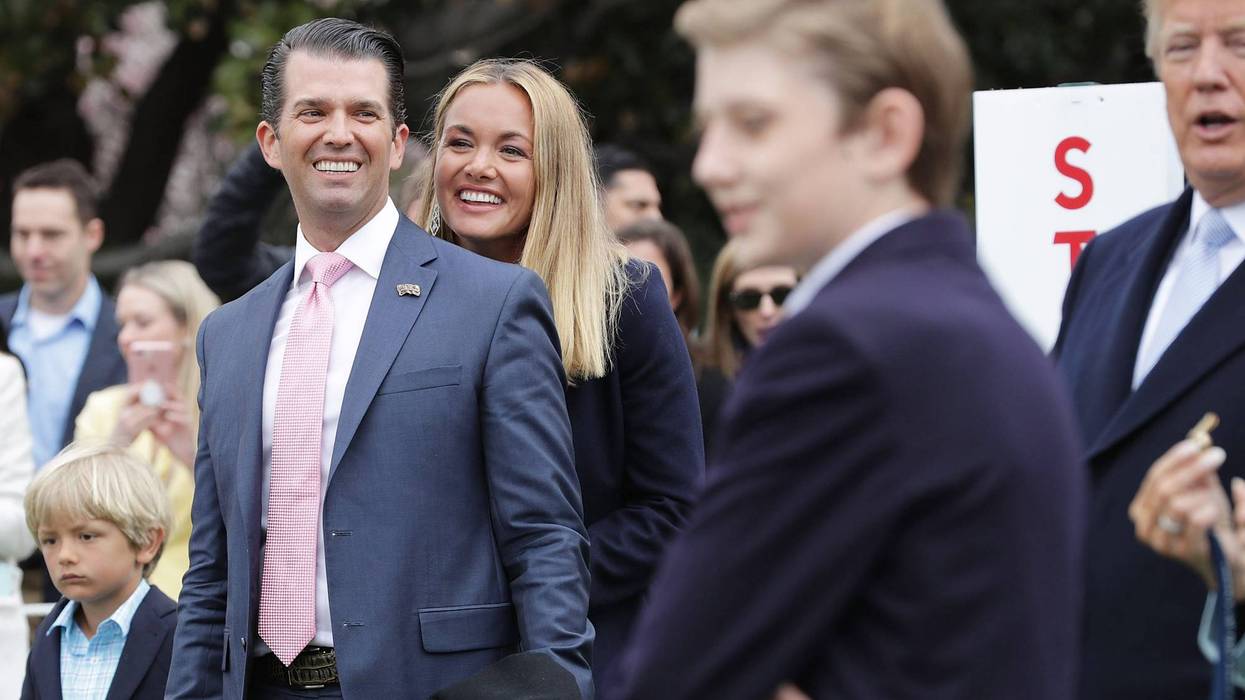Donald Trump Jr. (L) and his wife Vanessa Trump attend the 140th annual Easter Egg Roll with their five children, Barron Trump and President Donald Trump (R) on the South Lawn of the White House April 2, 2018 in Washington, DC.