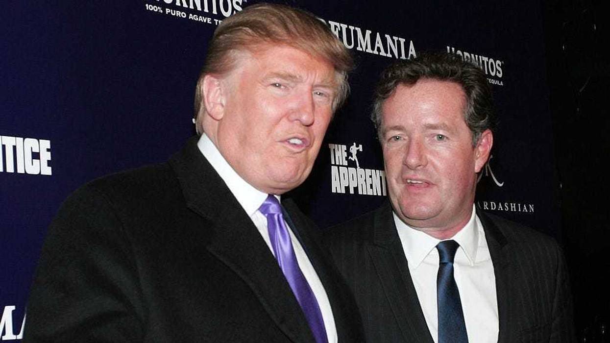 Donald Trump (L) and Piers Morgan celebrate Kim Kardashian's appearance on "The Apprentice" at Provacateur on November 10, 2010 in New York, New York.