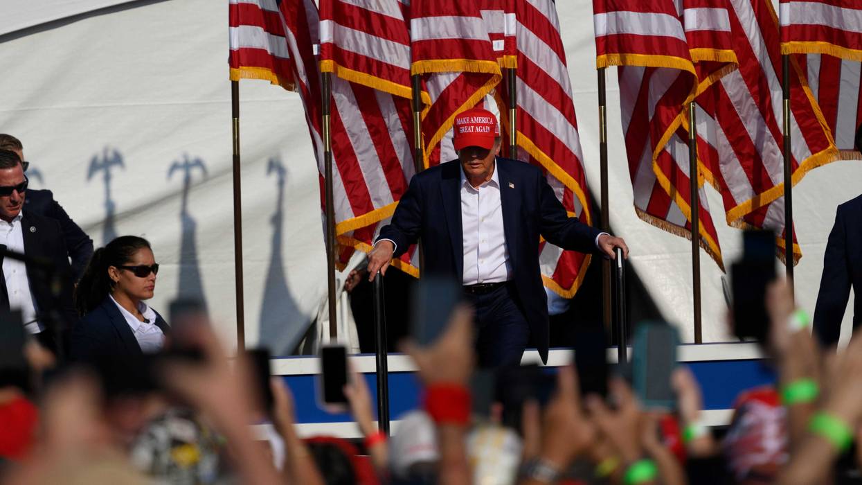 Donald Trump, on stage in Butler, Pennsylvania just before an assassination attempt, 7/13/24