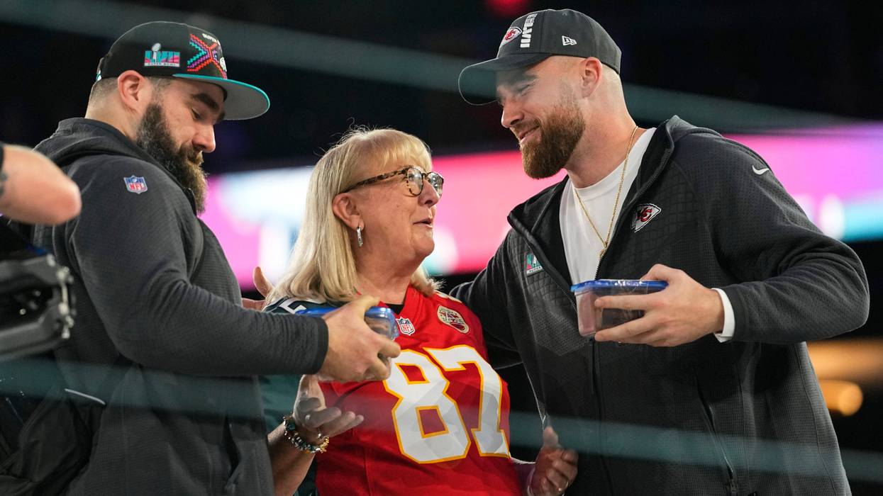 Donna Kelce greets her sons, Philadelphia Eagles center Jason Kelce, left, and Kansas City Chiefs tight end Travis Kelce during the NFL football Super Bowl 57 opening night, Feb. 6, 2023, in Phoenix.