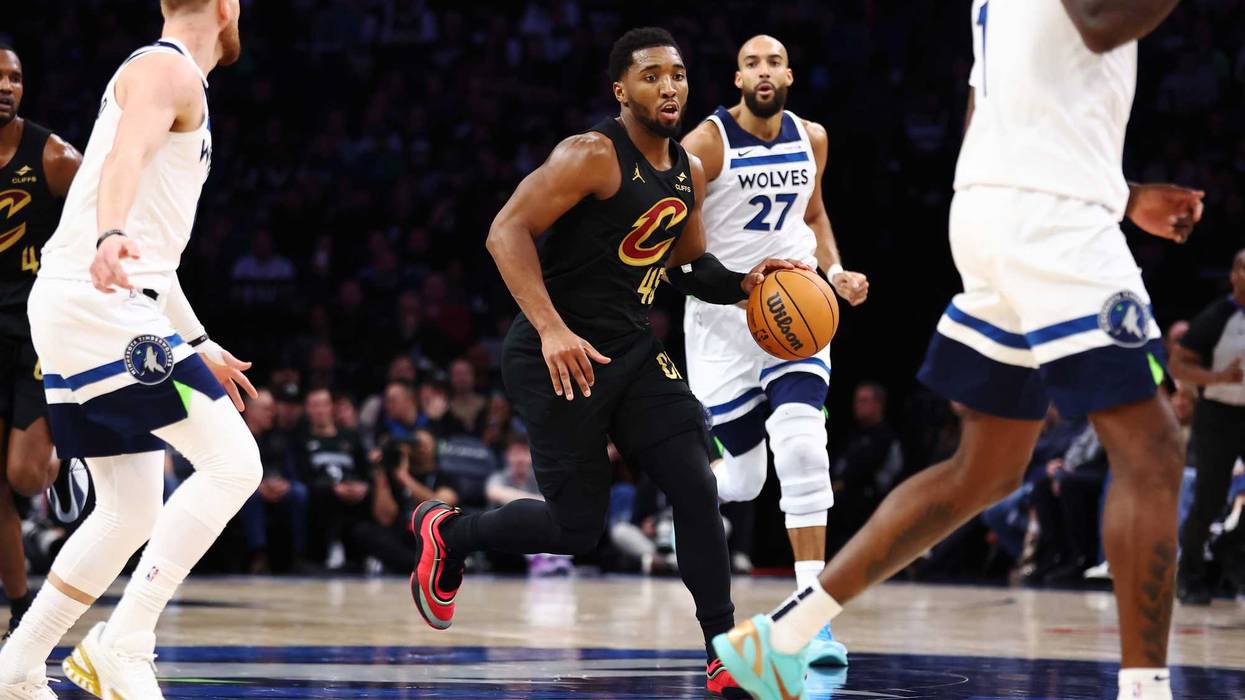 Donovan Mitchell #45 of the Cleveland Cavaliers dribbles the ball through mid-court during the second half against the Minnesota Timberwolves at Target Center on January 08, 2026 in Minneapolis, Minnesota. The Timberwolves beat the Cavaliers 131-122.