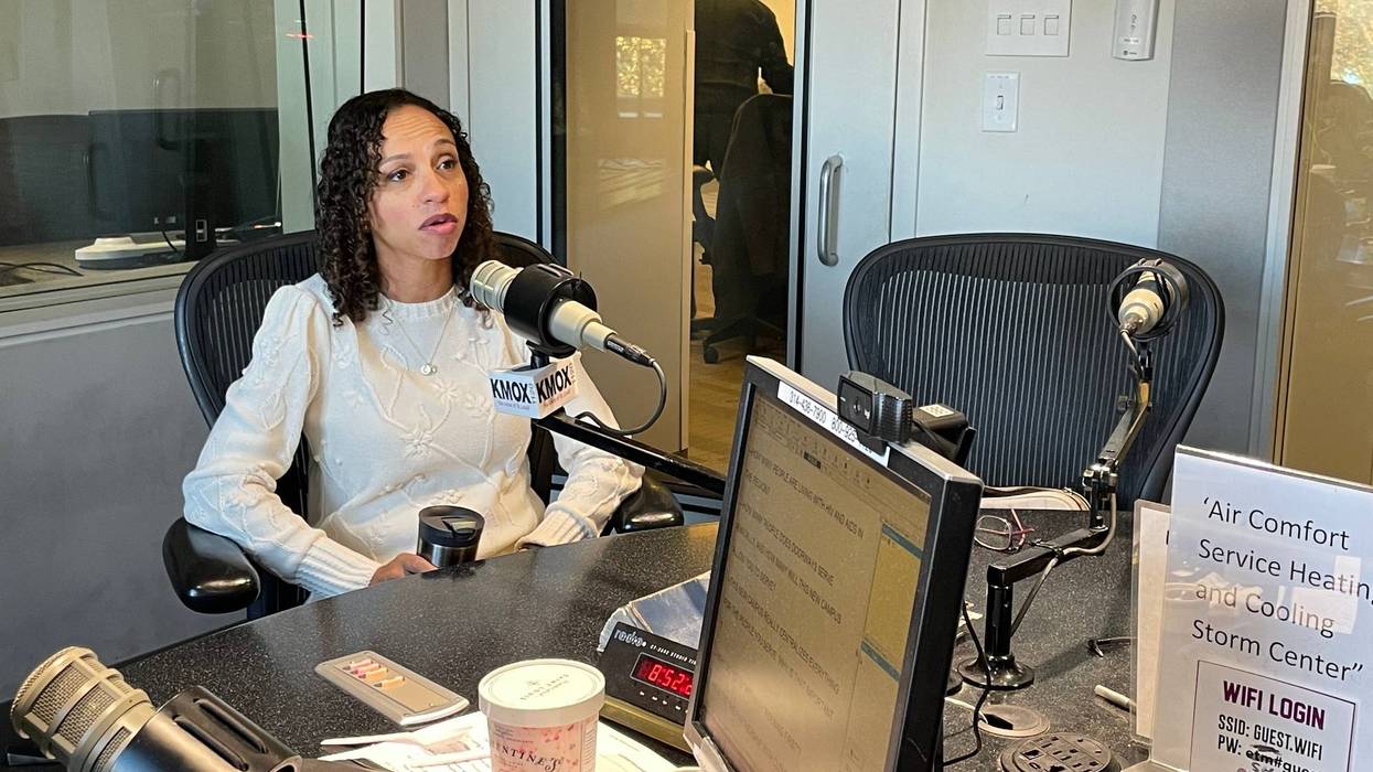 doorway's ceo opal jones in kmox studio. she has dark curly hair and a white sweater