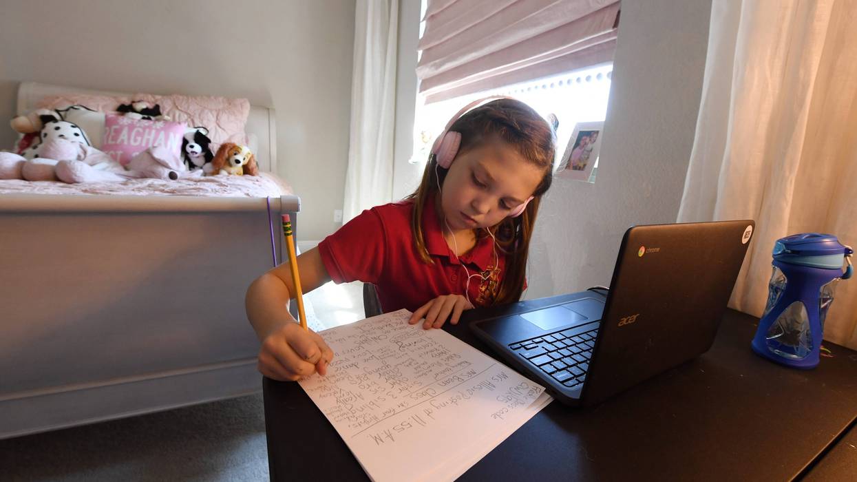 Doral Academy Red Rock Elementary School fourth grader Reaghan Keeler, 9, attends an online reading class from her bedroom on her first day of distance learning amid the spread of the coronavirus (COVID-19) on August 24, 2020