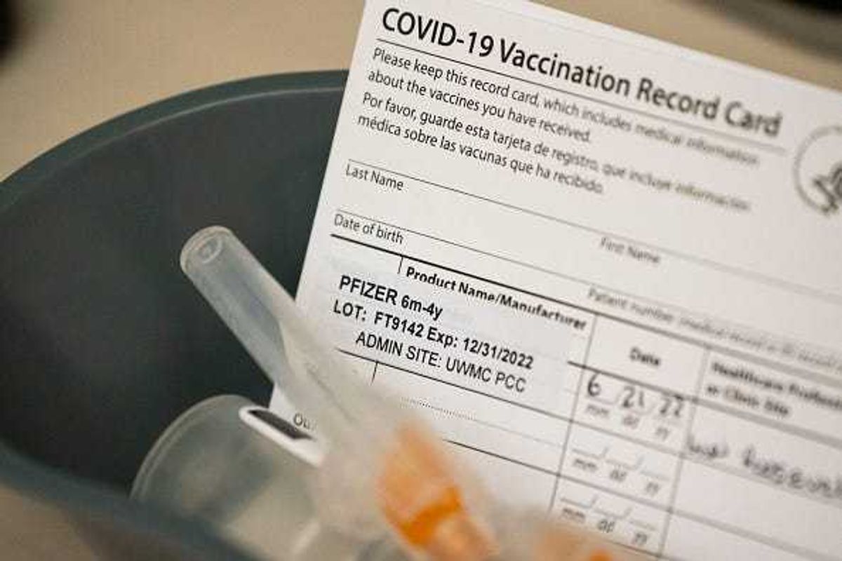 Doses of the Pfizer Covid-19 vaccine and vaccination record cards await pediatric patients at UW Medical Center - Roosevelt on June 21, 2022 in Seattle, Washington.