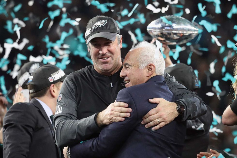 Doug Pederson hugs Jeffrey Lurie