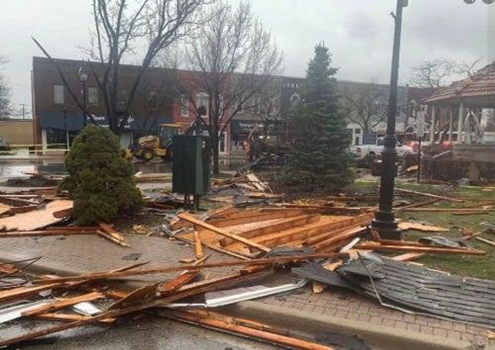 Downtown Dundee after a severe storm with high winds. Wood and roofing debris is strewn around the village square.