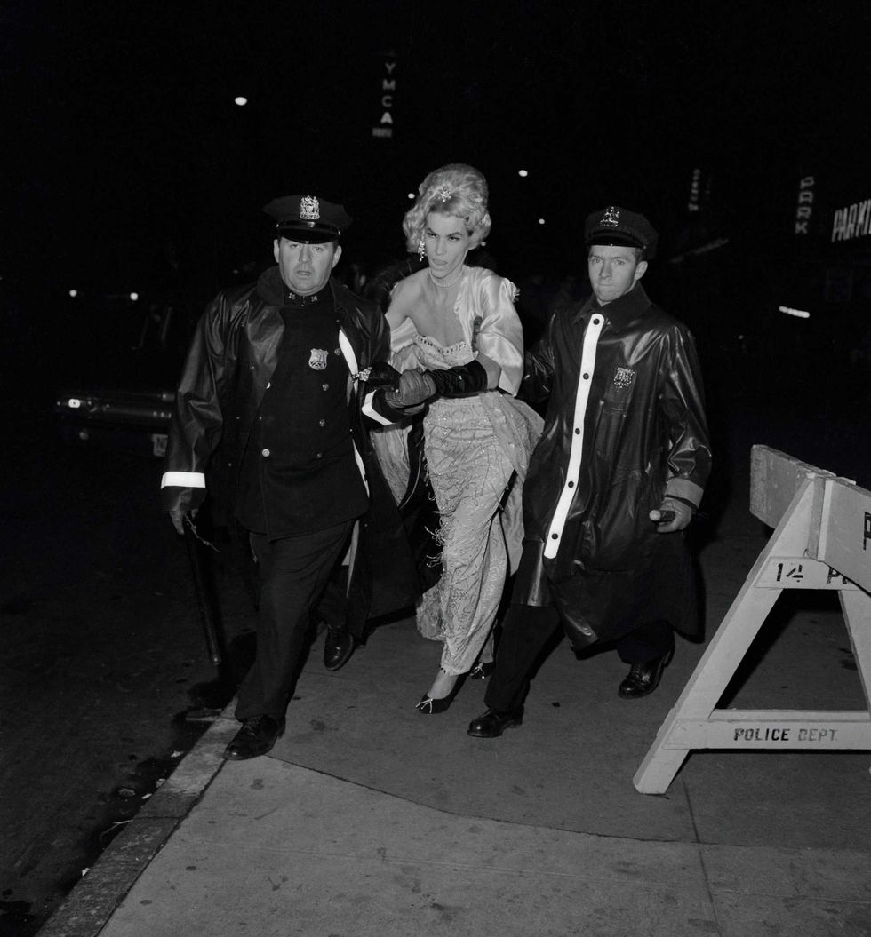 Dozens of men dressed in drag were arrested for "indecent exposure" and "masquerading" at the National Variety Artists