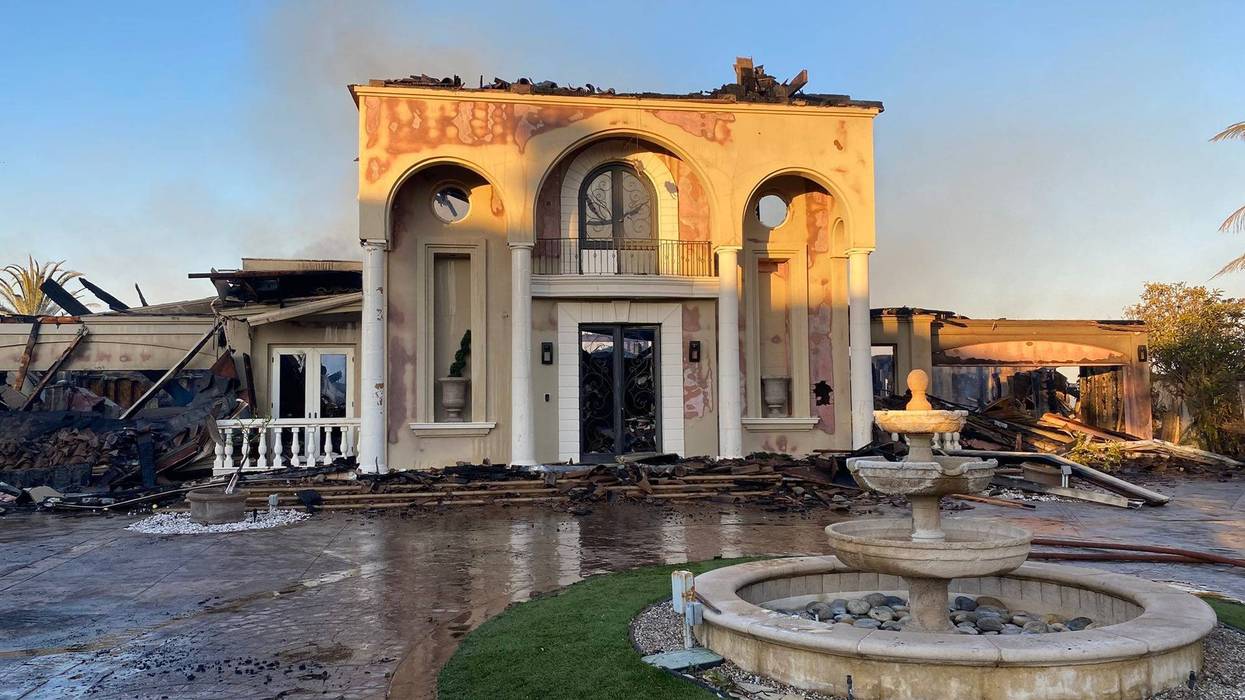 Dozens of multi-million dollar homes have been destroyed after a wildfire ripped through an upscale community in Orange County Wednesday.