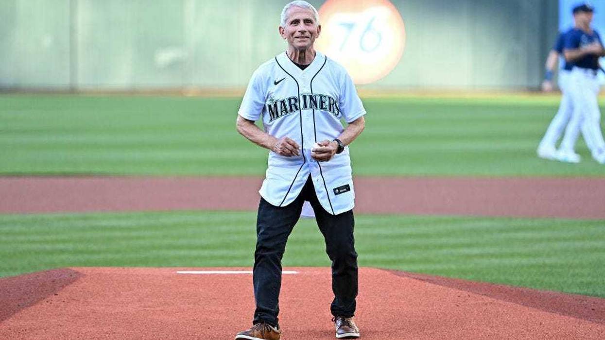Dr. Anthony Fauci, director of the National Institute of Allergy and Infectious Diseases and chief medical advisor to the U.S. president, throws out the ceremonial first pitch before the game between the Seattle Mariners and the New York Yankees at T-Mobile Park on August 09, 2022 in Seattle, Washington. (Photo by Alika Jenner/Getty Images)