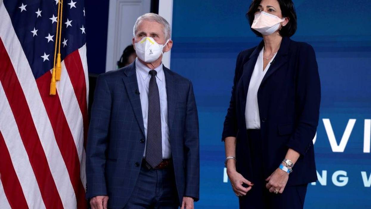 Dr. Anthony Fauci, Director of the National Institute of Allergy and Infectious Diseases and the Chief Medical Advisor to the President, and Centers for Disease Control and Prevention Director Rochelle Walensky, arrive for a video call with U.S. President Joe Biden, the White House Covid-19 Response team and the National Governors Association in the South Court Auditorium at the Eisenhower Executive Office Building on December 27, 2021 in Washington, DC.