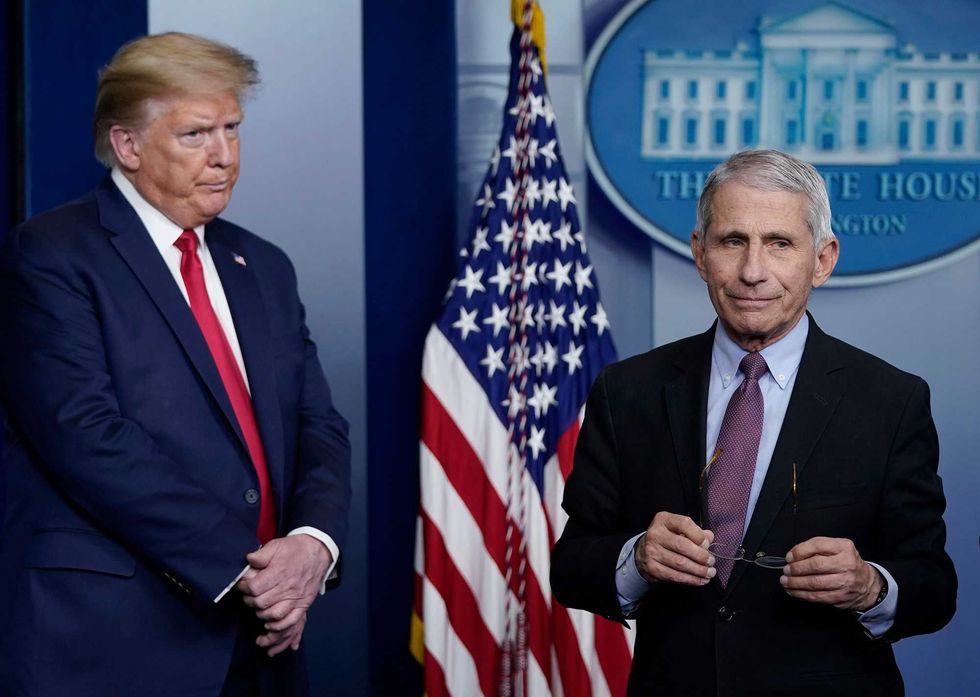 Dr. Anthony Fauci (R), director of the National Institute of Allergy and Infectious Diseases, and U.S. President Donald Trump participate in the daily coronavirus task force briefing at the White House on April 22, 2020 in Washington, DC.