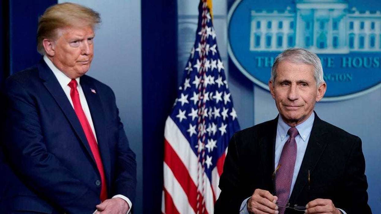 Dr. Anthony Fauci (R), director of the National Institute of Allergy and Infectious Diseases, and U.S. President Donald Trump participate in the daily coronavirus task force briefing at the White House on April 22, 2020 in Washington, DC.