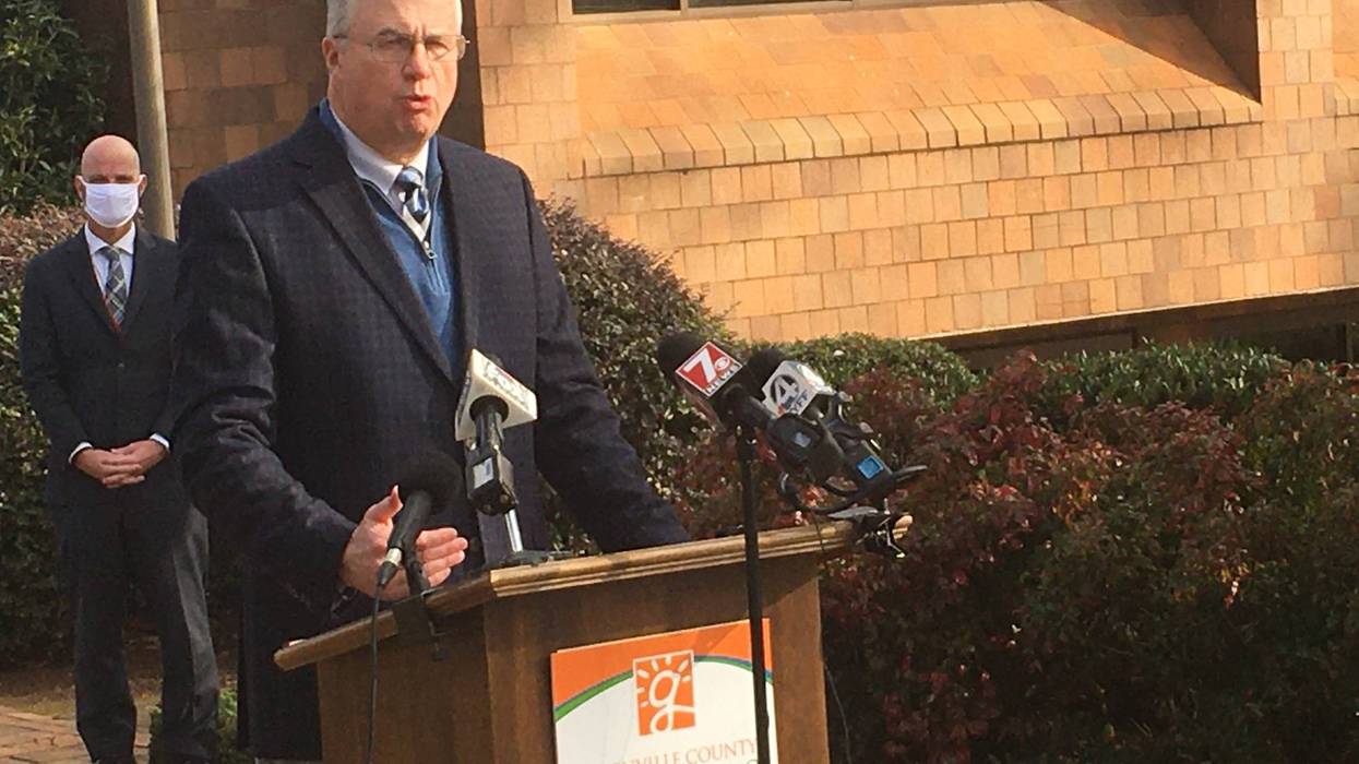 Dr. Burke Royster speaking at press conference