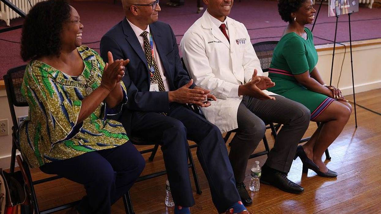 Dr. Geralde Gabeau, Founder and Executive Director of the Immigrant Families Services Institute laughs as she sits beside Jay Trivedi, CEO of Upham's Corner Community Health Center, Dr. Alister Martin, Founder and Managing Director of Link Health and Stephanie Garrett-Stearns, Senior Vice President of Communications and Fund Development for The Community Builders, who all received grant money for their respective foundations at the Great Hall at Codman Square Health Center on July 28, 2025.