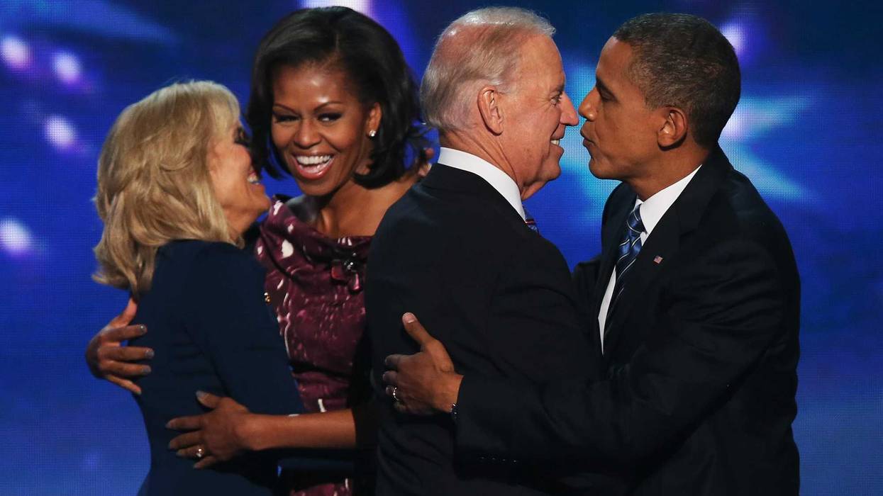 Dr. Jill Biden hugs Michelle Obama, as Joe Biden greets Barack Obama on stage after accepting the nomination during the final day of the Democratic National Convention at Time Warner Cable Arena on September 6, 2012 in Charlotte, North Carolina.