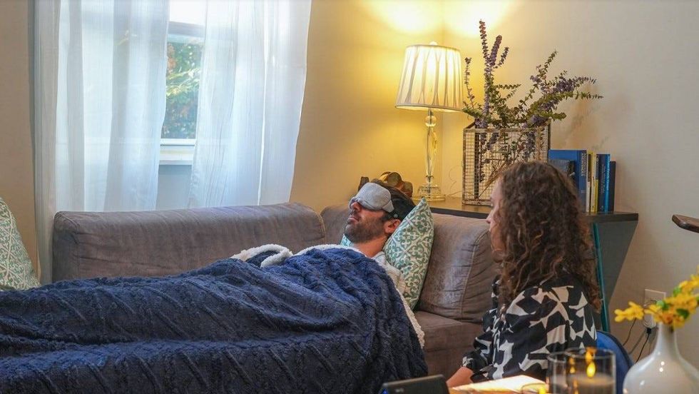 Dr. Sophia Brandstetter, founder of the Ko-Op in Graduate Hospital, simulates the start of a ketamine-assisted therapy session with Brian Seltzer (everything but the ketamine!)