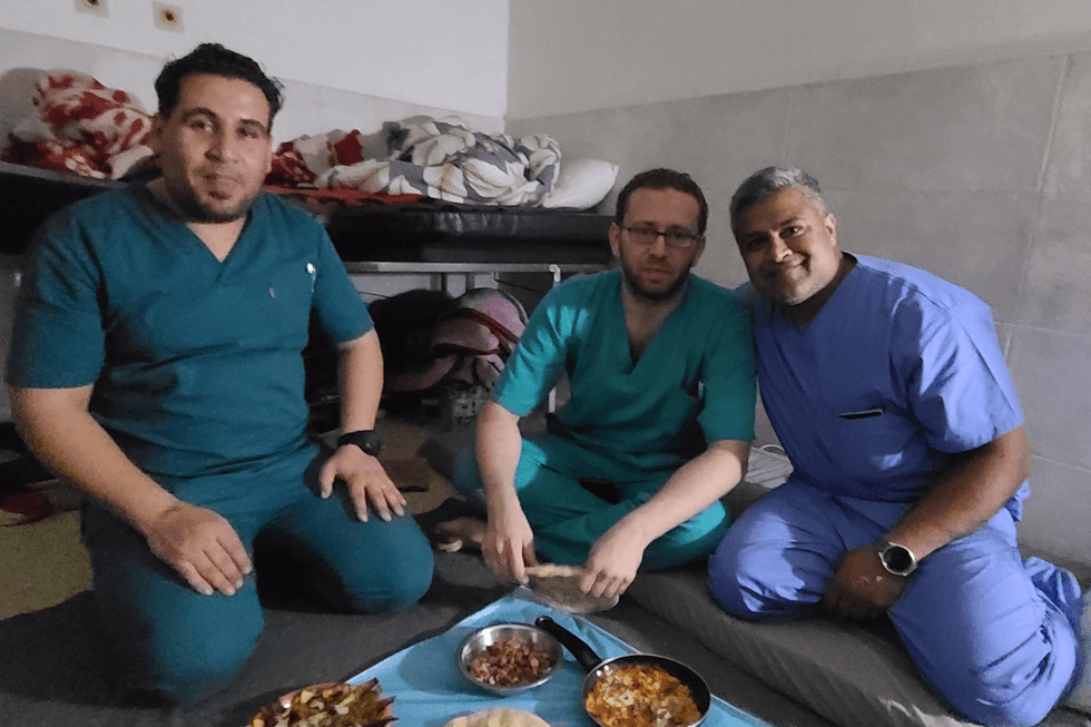 Dr. Syed Sayeed, a plastic surgeon from Long Island, poses with fellow doctors during a volunteer trip to Gaza in April 2024.