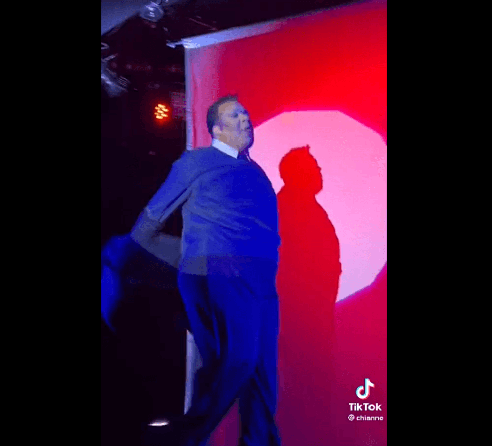 Drag queen Meatball channels the suit-and-tie version of Rep. George Santos at Sasha Velour