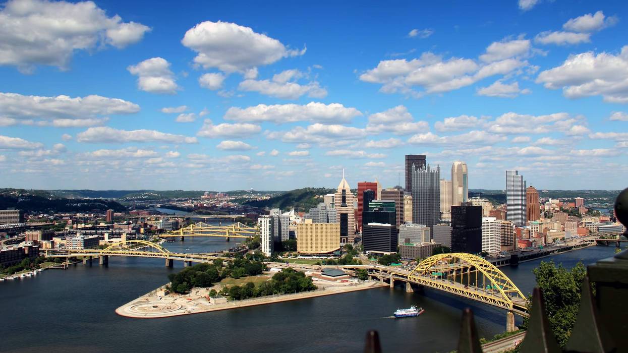 Dramatic shot of a summer day over Pittsburgh, PA. As seen from Mount Washington. Corporate logos digitally removed for general usage.