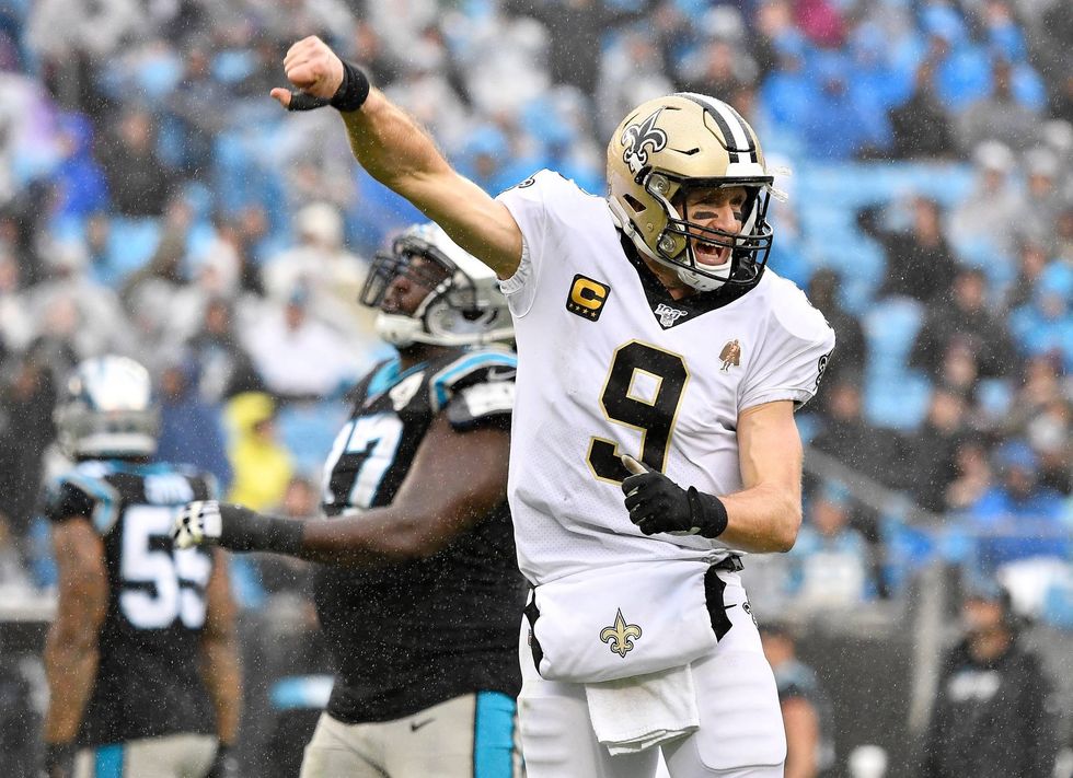 Drew Brees reacts to throwing a touchdown against Carolina