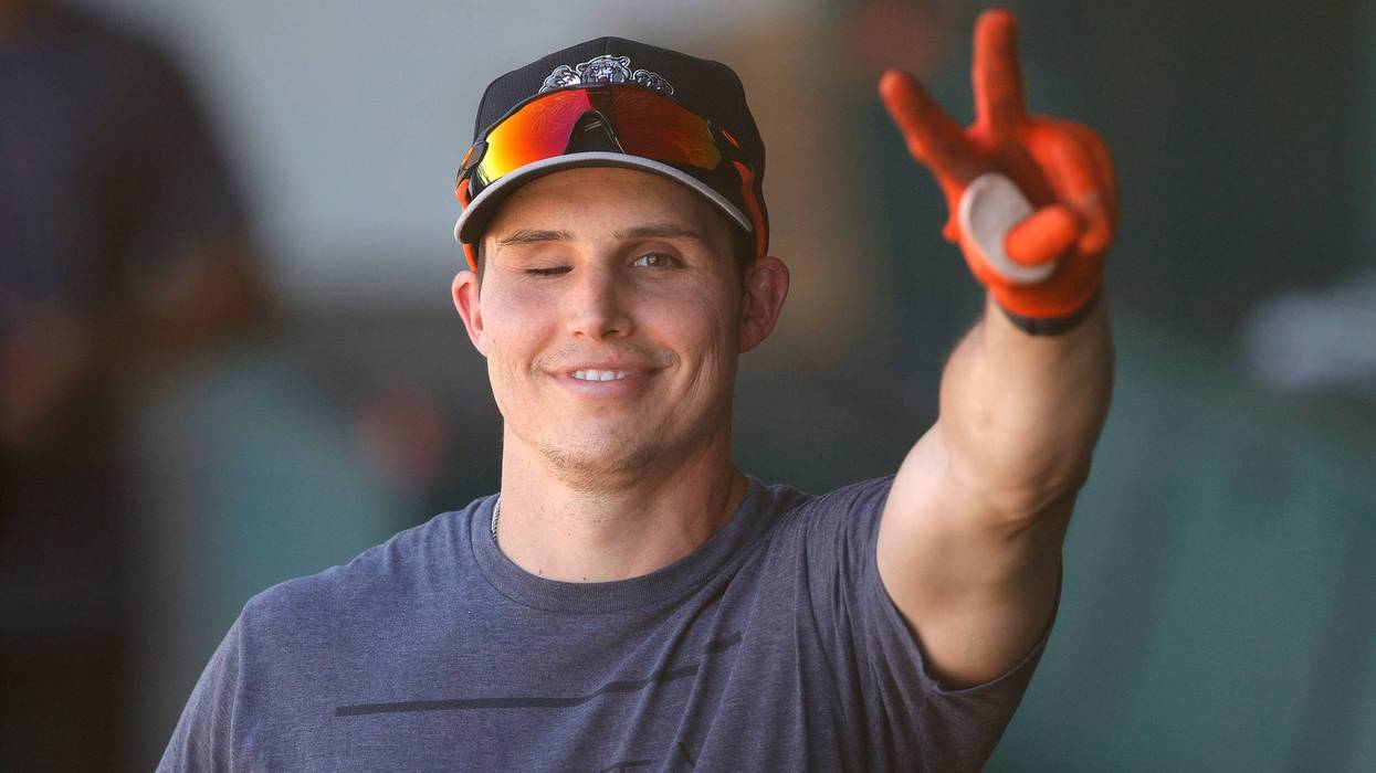 Drew Robinson #5 of the Sacramento River Cats waves from the dugout before a game against the Las Vegas Aviators at Sutter Health Park on May 27, 2021 in Sacramento, California.