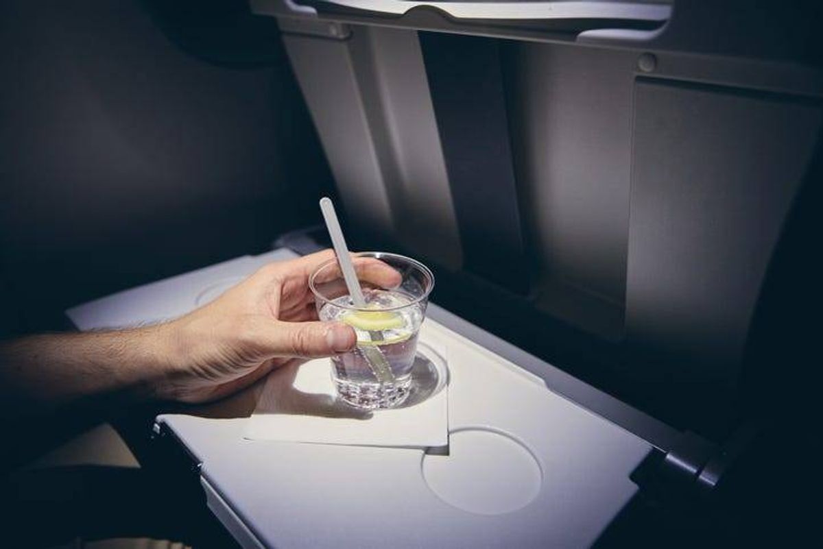 Drinking soda on a plane