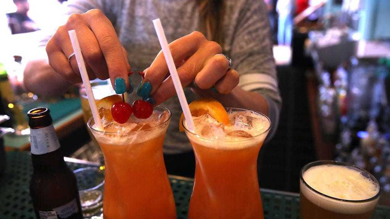 Drinks with plastic straws at a bar
