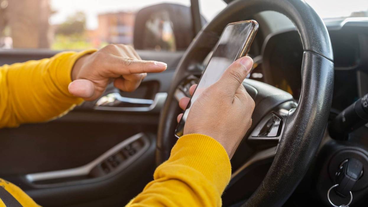 Driver using a phone.