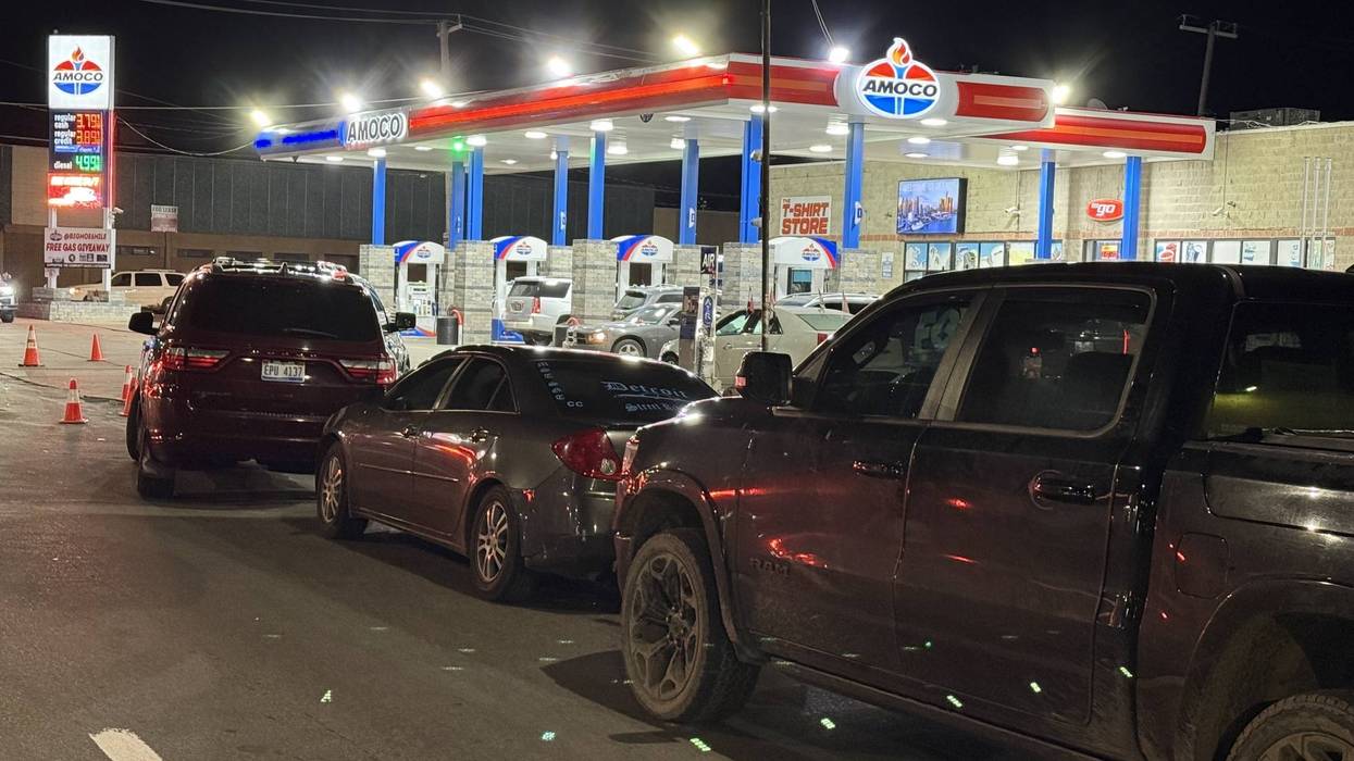 Drivers line up early Wednesday morning for free gas at Detroit station