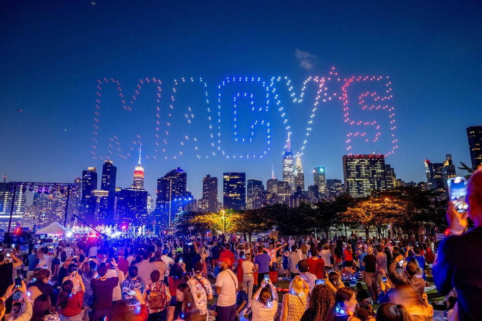 Drones perform a light show before the Macy
