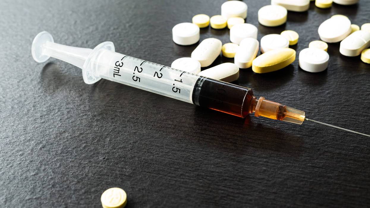 Drug syringe and pills