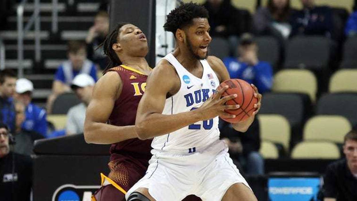Duke center Marques Bolden in action against Iona forward Tyrell Williams during the first round of the NCAA tournament on March 15, 2018, at PPG Paints Arena.