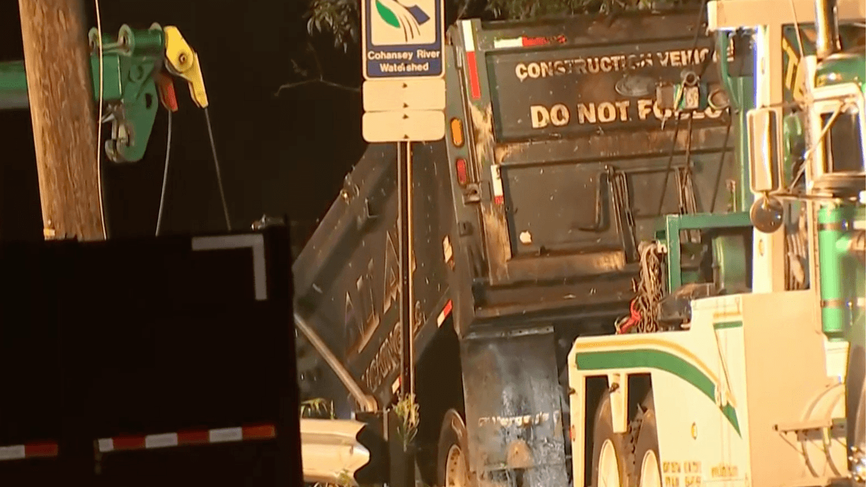 dump truck pulled from river