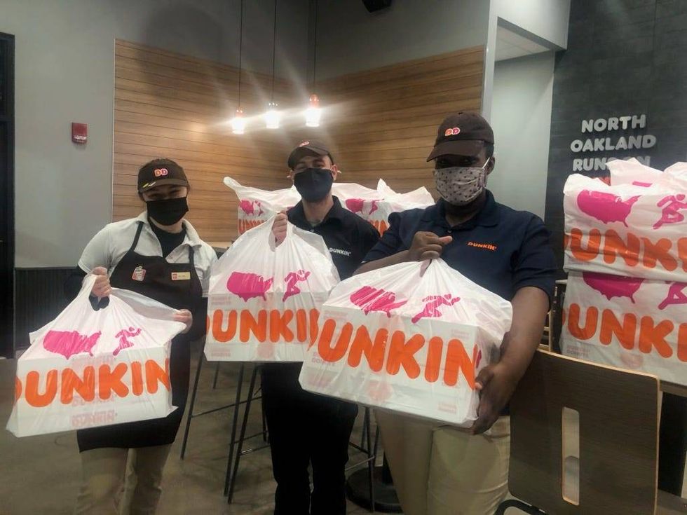 Dunkin team members drop off donuts at AHN COVID vaccination clinic at PNC Park