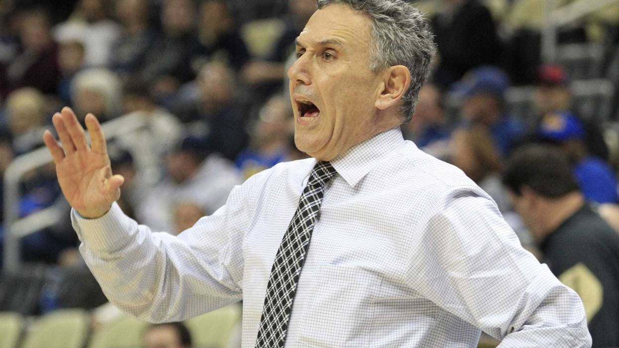 Duquesne Dukes head coach Frank Dambrot reacts on the bench against the Pittsburgh Panthers during the first half at PPG Paints Arena.