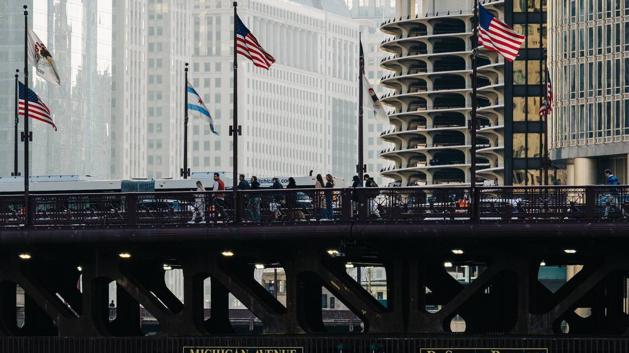 DuSable Bridge spanning Chicago river with boat