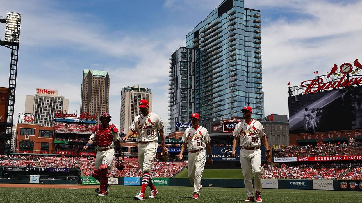 dusty blake and four others walking on the field