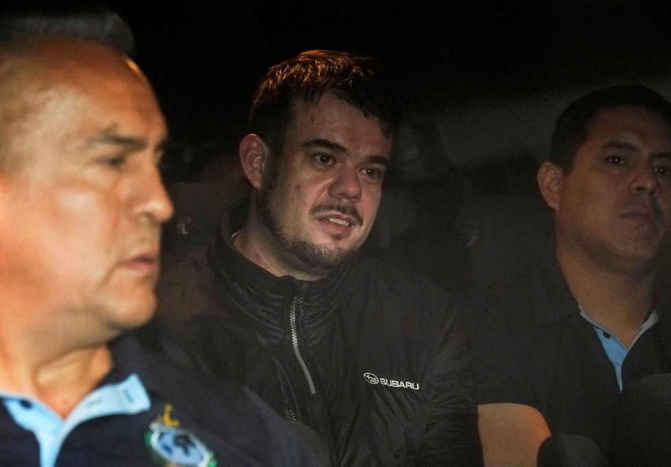 Dutch citizen Joran van der Sloot is driven in a police vehicle from a maximum-security prison to an airport to be extradited to the U.S., on the outskirts of Lima, Peru, Thursday, June 8, 2023.
