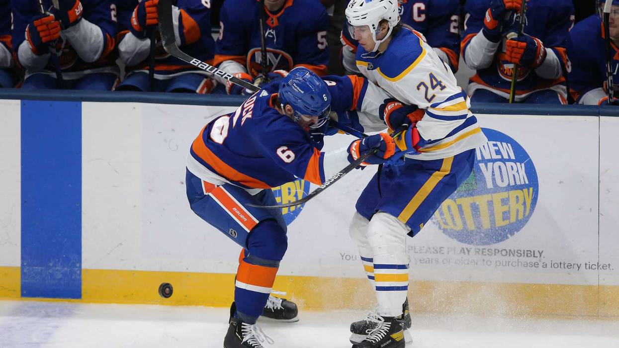 Dylan Cozens battles Ryan Pulock