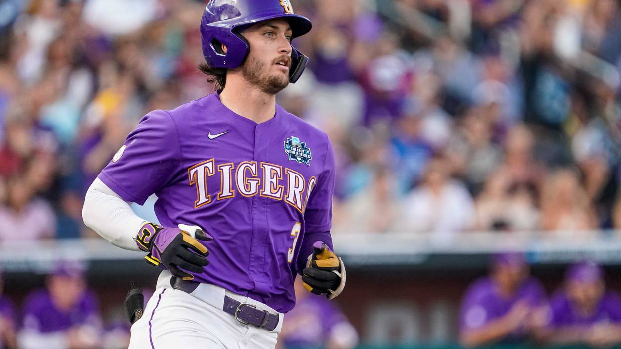 Dylan Crews runs to first base after hitting a single against the Tennessee Volunteers