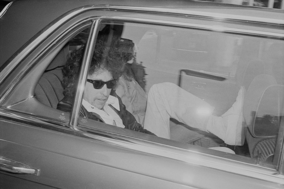 Dylan sitting inside a car in 1978, right around the time he purchased Minneapolis