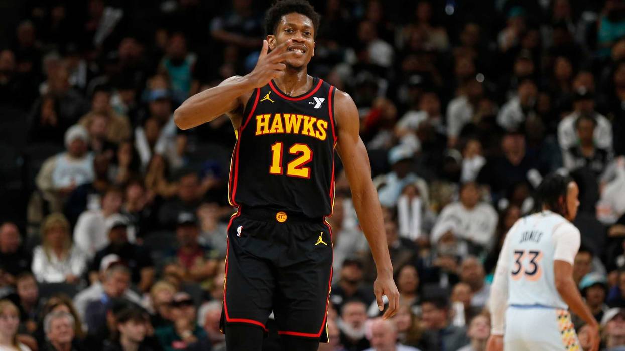 e'Andre Hunter #12 of the Atlanta Hawks reacts after scoring against the San Antonio Spurs in the second half at Frost Bank Center on December 19, 2024 in San Antonio, Texas.