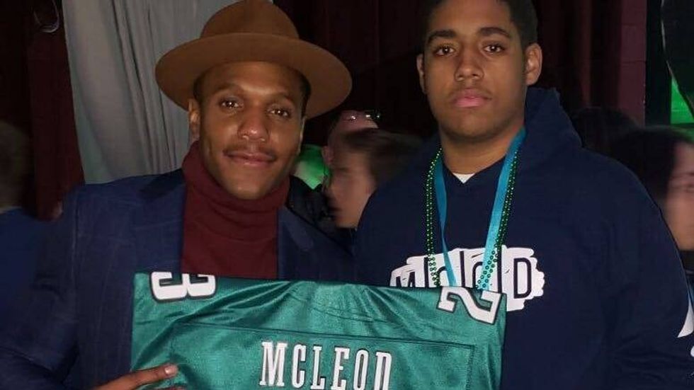 Eagles player Rodney McLeod and Isaiah Harris of Germantown at the 2018 Fashion Touchdown