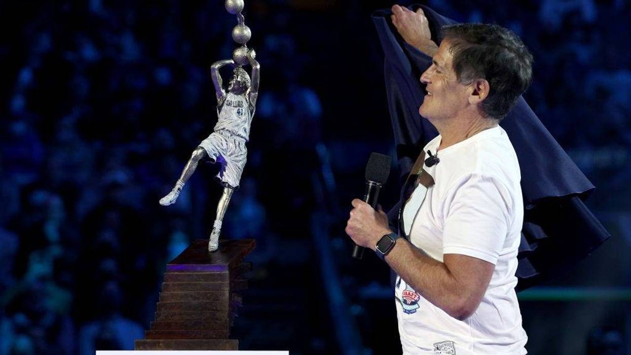 eam owner Mark Cuban unveils a replica statue of former player Dirk Nowitzki during a ceremony honoring Nowitzki's career and retiring his No. 41 jersey at American Airlines Center on January 05, 2022 in Dallas, Texas.