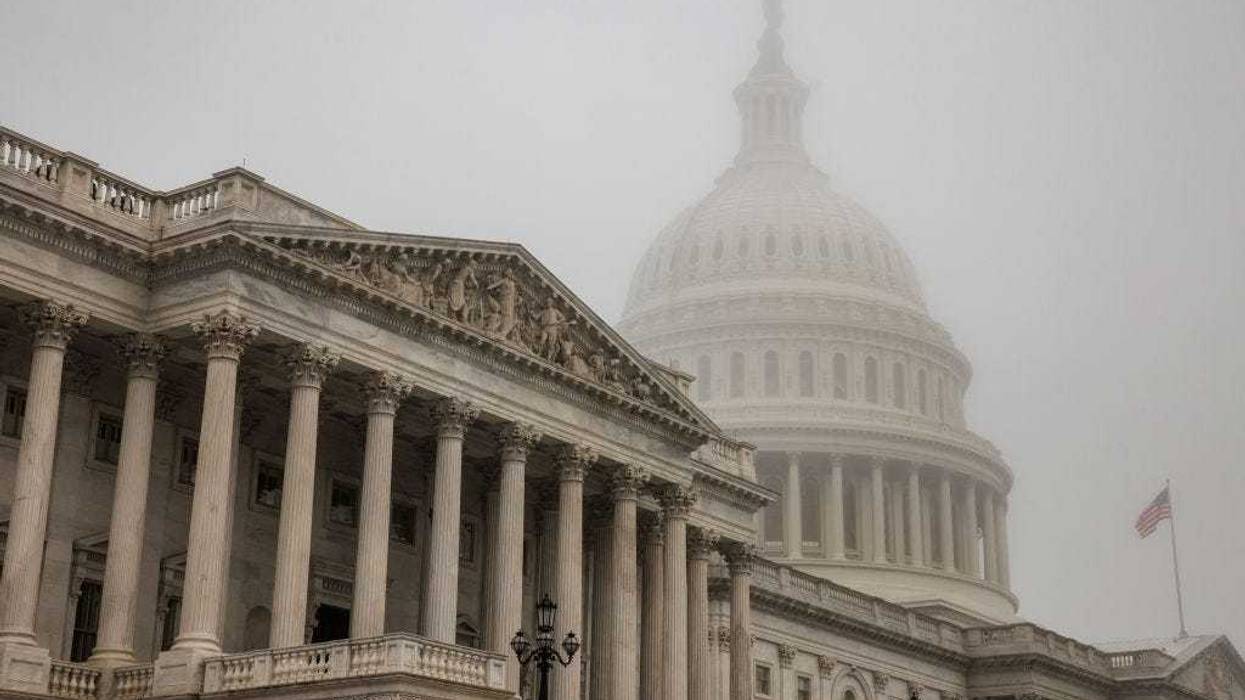 Early morning fog envelopes the U.S. Capitol dome behind the U.S. House of Representatives on November 4, 2022 in Washington, DC. Republicans are poised to regain control of the U.S. Congress in the midterm elections on November 8 after the Democrats gained the majority in both the House in 2018 and Senate in 2020. (Photo by Samuel Corum/Getty Images)
