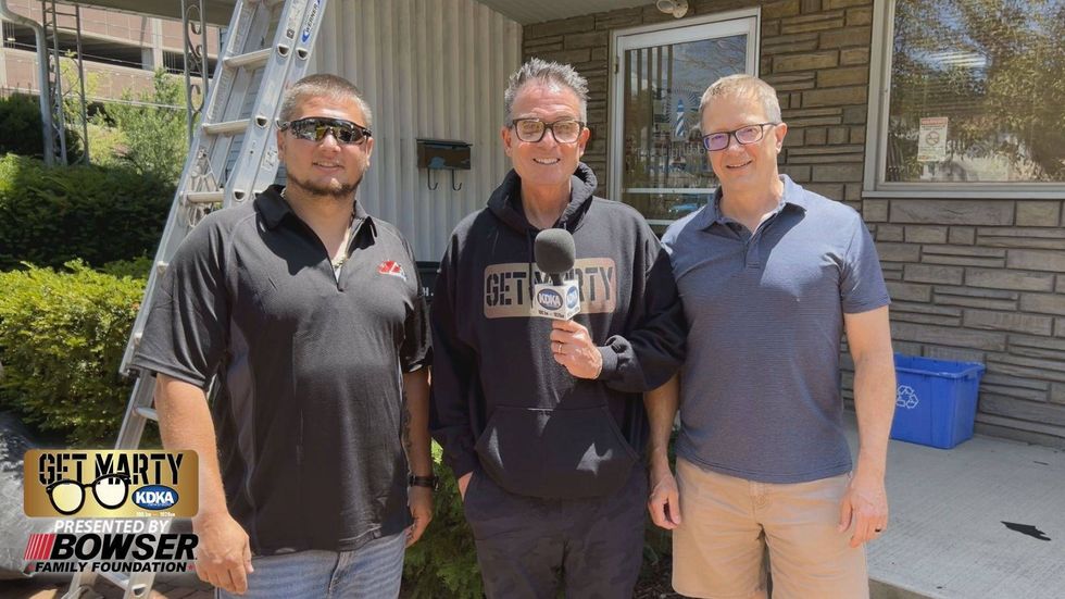 EAS Roofing owner Eugene Smith, Marty Griffin, and Doug Snyder from The Lighthouse Foundation