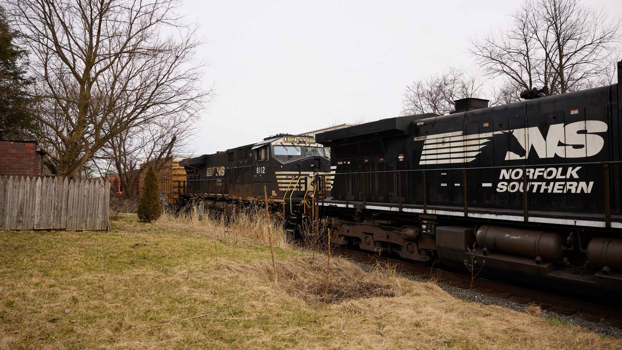 EAST PALESTINE, OH - FEBRUARY 14: A Norfolk Southern train is en route on February 14, 2023 in East Palestine, Ohio. Another train operated by the company derailed on February 3, releasing toxic fumes and forcing evacuation of residents.